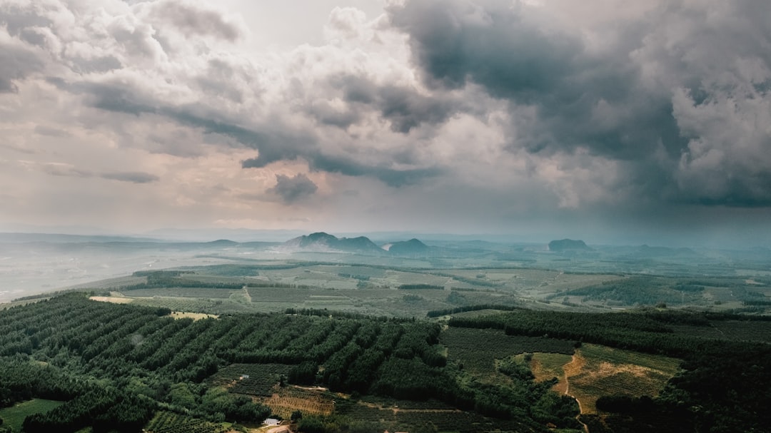 grey cloudy sky hovering above the farm land