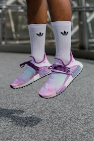 Knee-high sublimation socks featuring bold, energetic designs against a sporty backdrop.