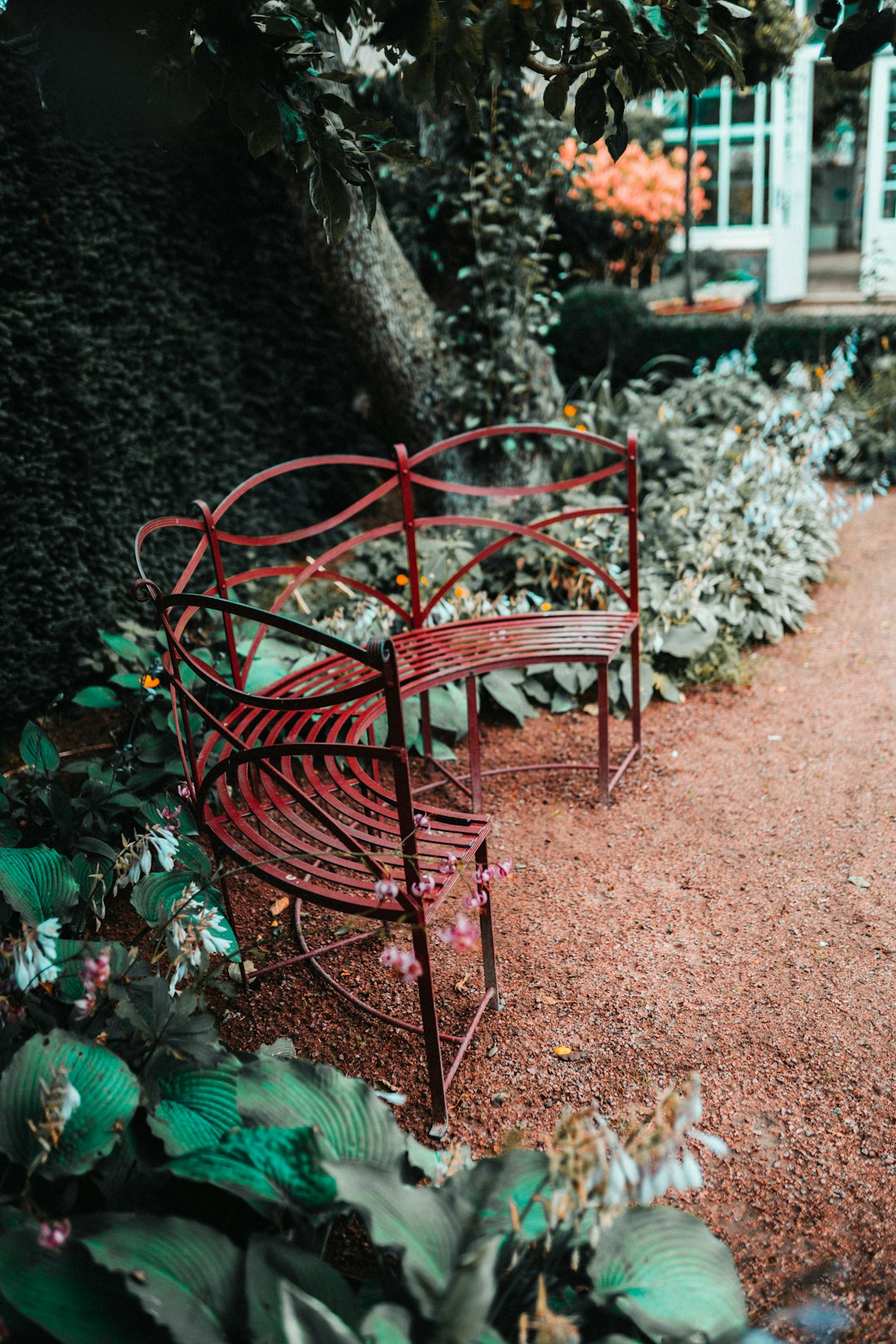 red metal C-shaped bench