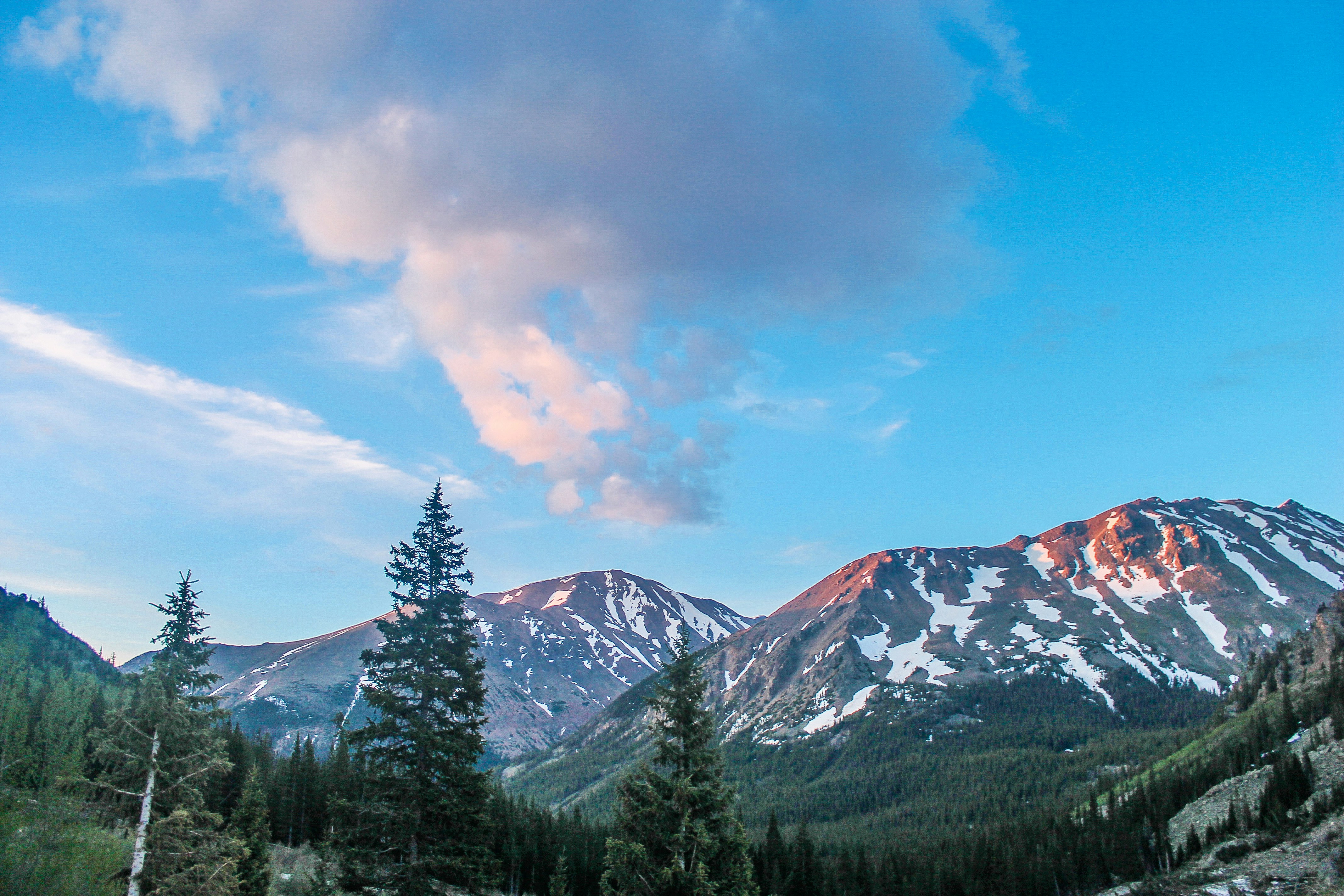white snow capped mountains in horizon