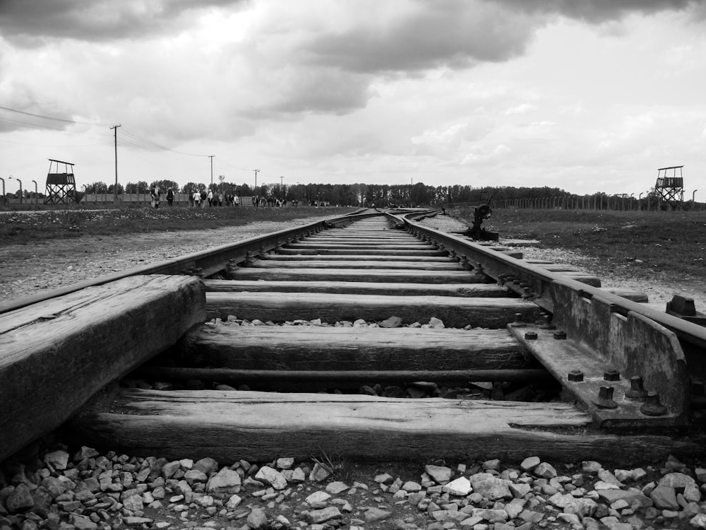 selective focus photography of train rail