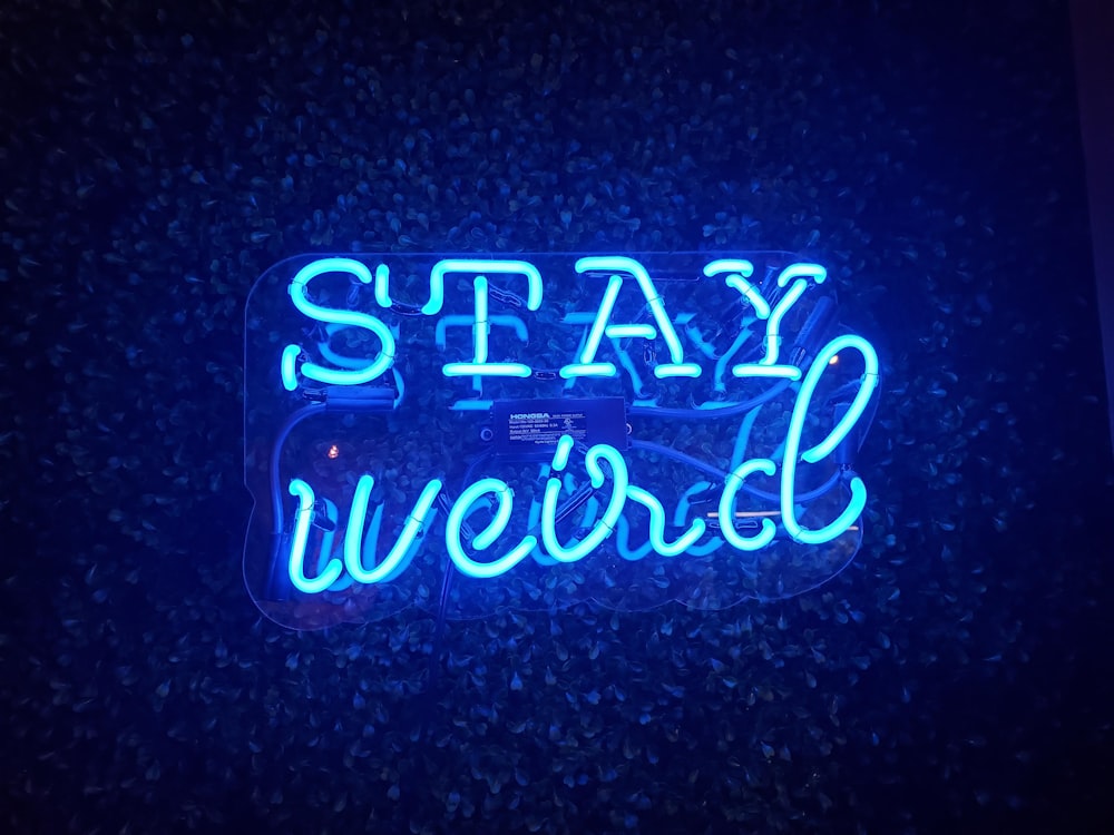 blue Stay Weird neon light signage