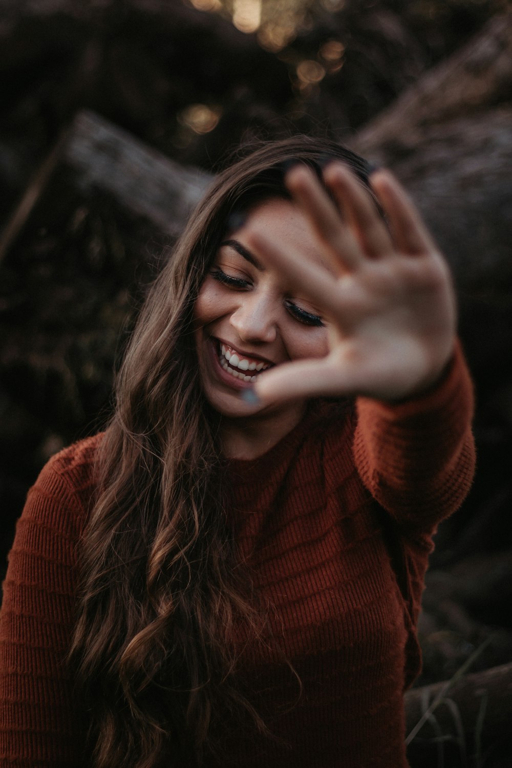 woman in brown sweater on focus photography