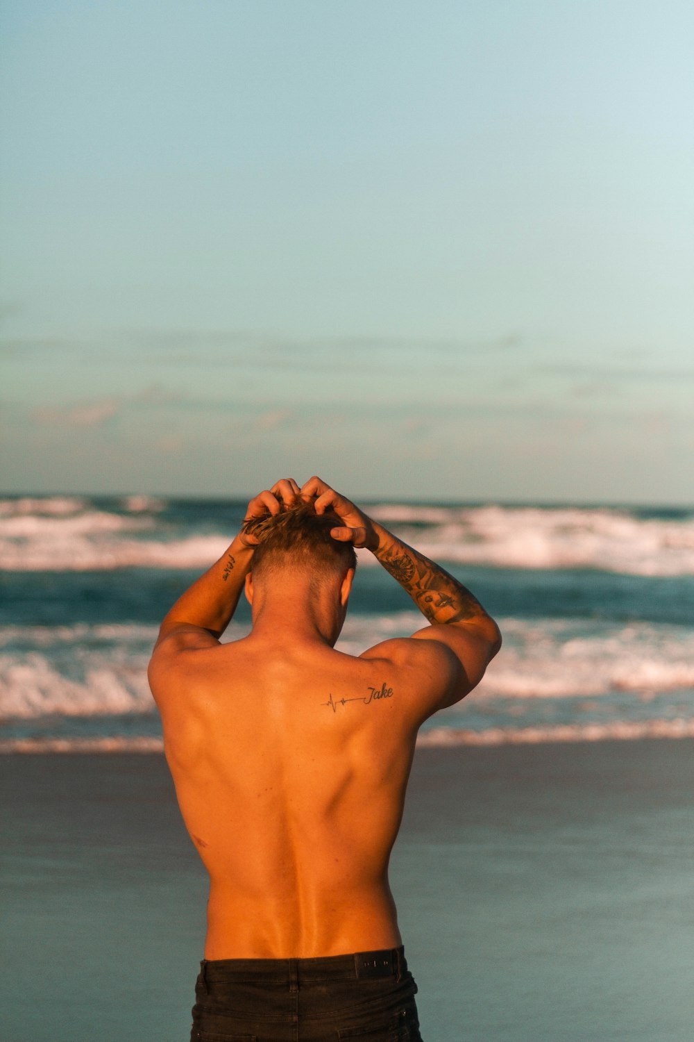 man standing near beach