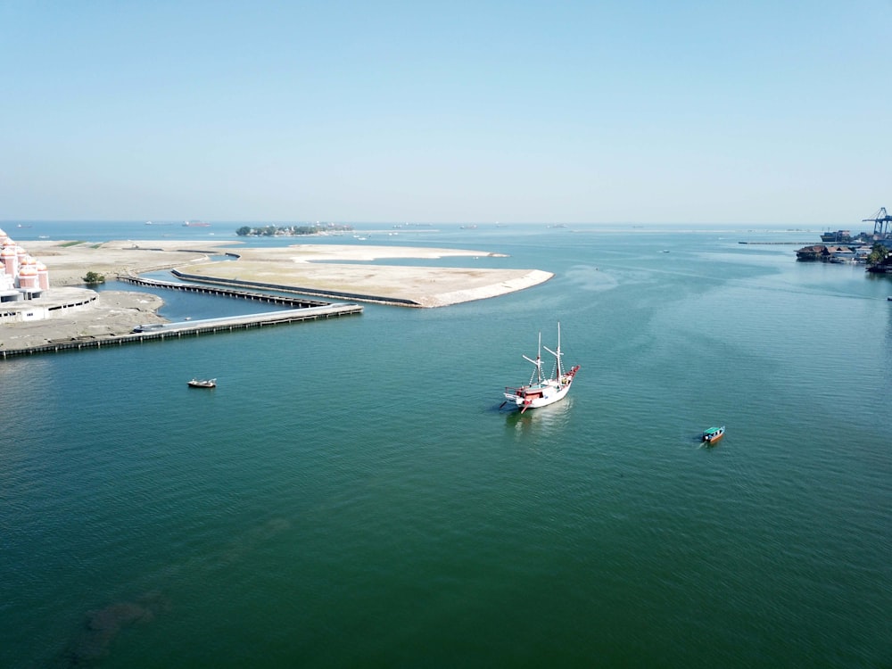 photography of boat traveling during daytime