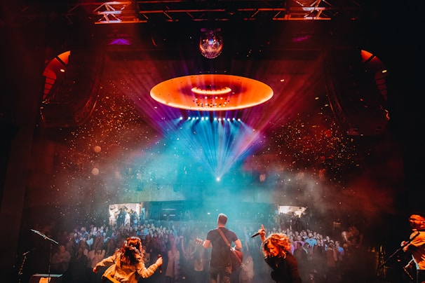 a group of people standing on top of a stage