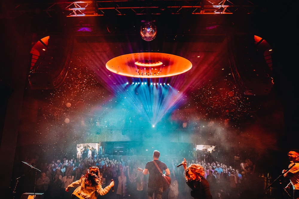 a group of people standing on top of a stage