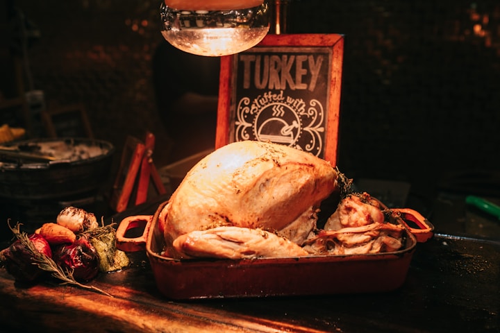 thanksgiving day turkey on a table with a sign that reads turkey.