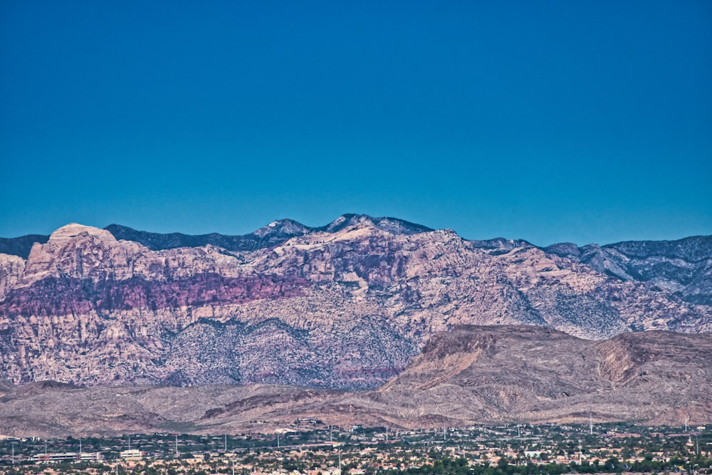 brown and white mountains under blue sky during daytime