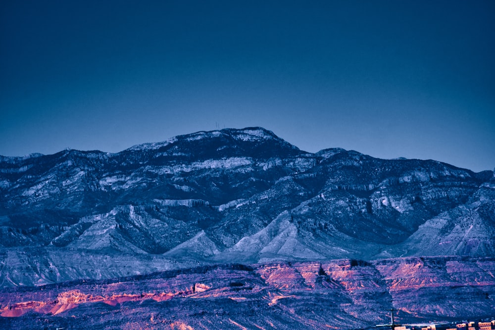 snow covered mountain under blue sky during daytime