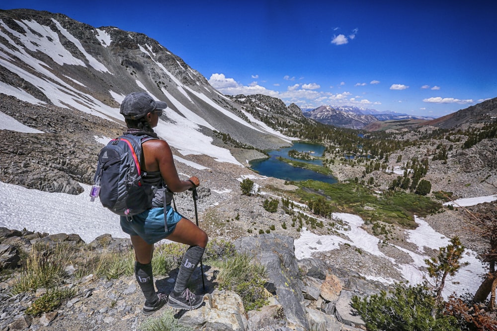 man standing on top of hill during daytime