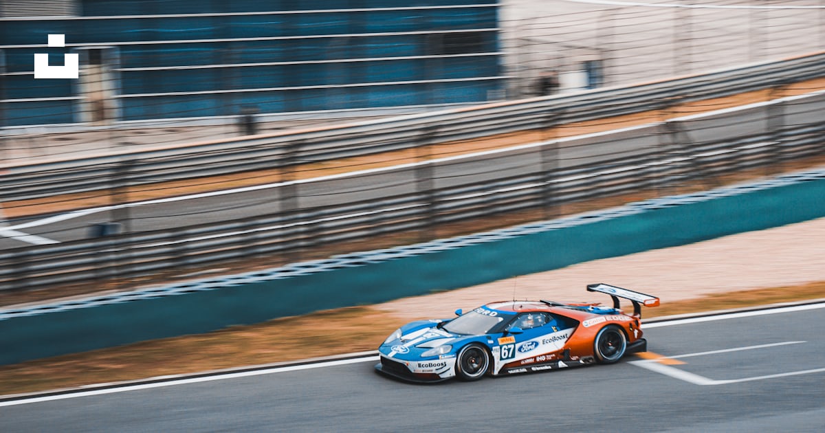 Blue and white racing car photo – Free Teal Image on Unsplash