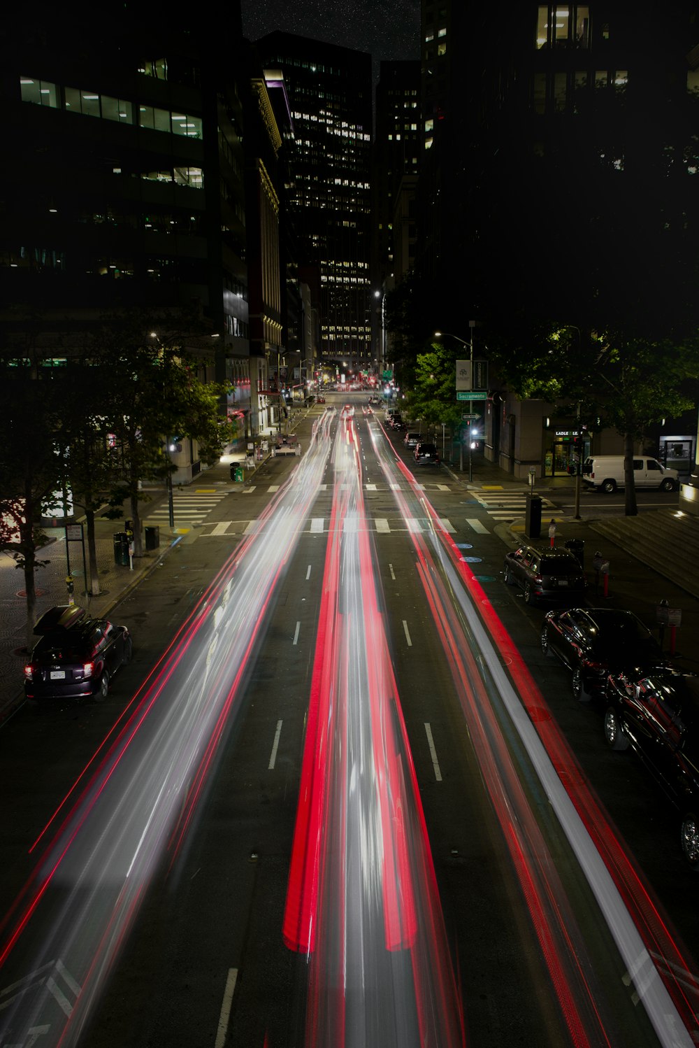 time-lapse photo of vehicles on road during night