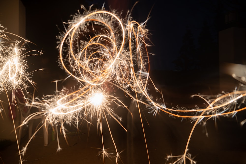 a person holding a sparkler in their hand