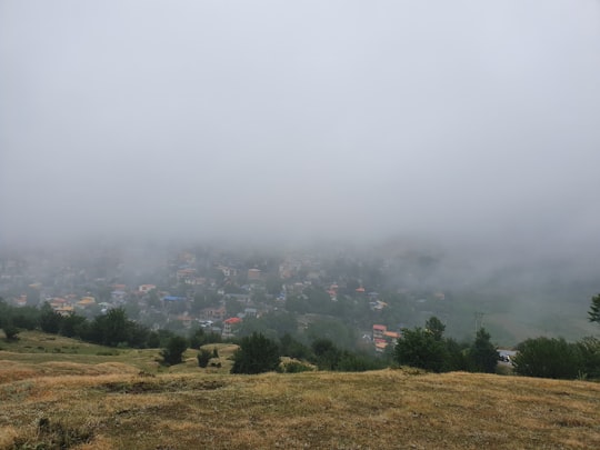 grassland across town buildings during daytime in Mazandaran Province Iran