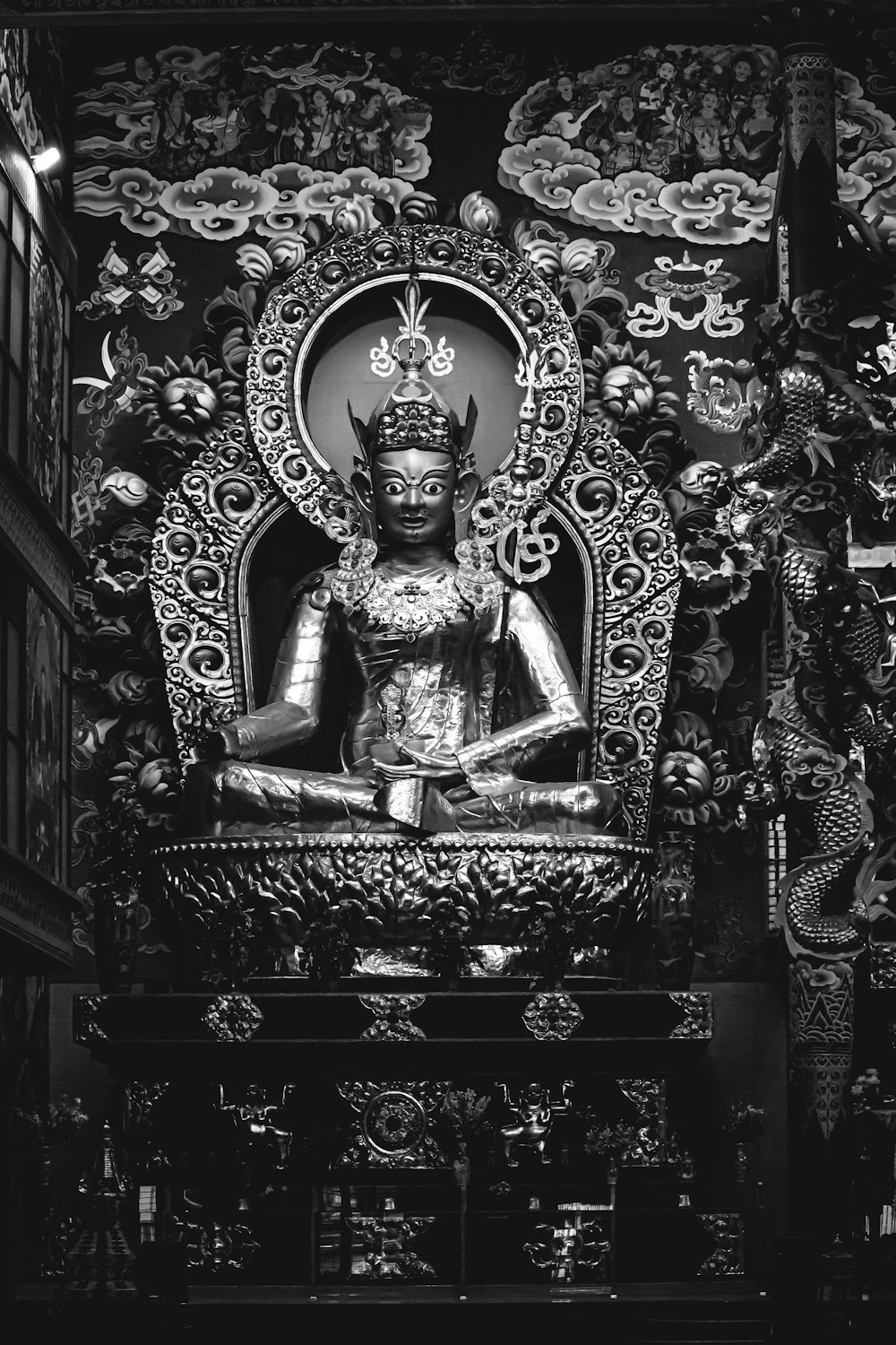 grayscale photo of Hindu god statue