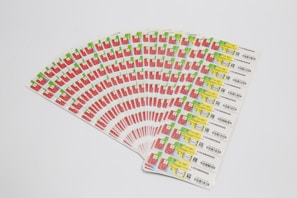 Close-up of various RFID antenna labels arranged on a white surface, showing their intricate patterns.