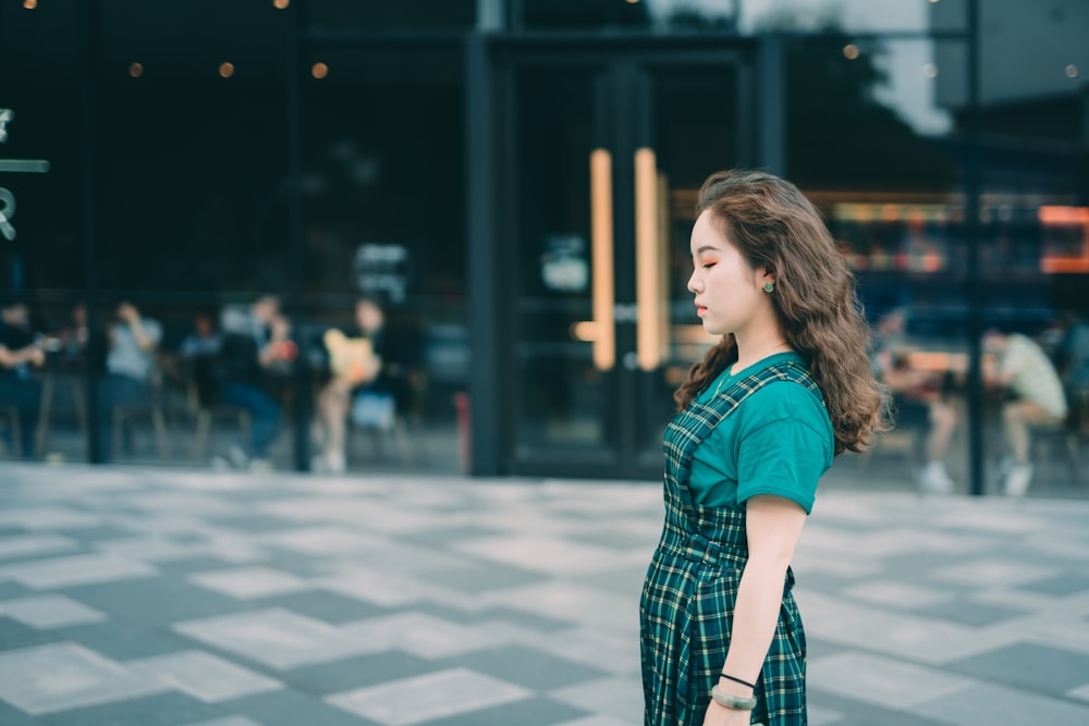 woman wearing green romper and t-shirt