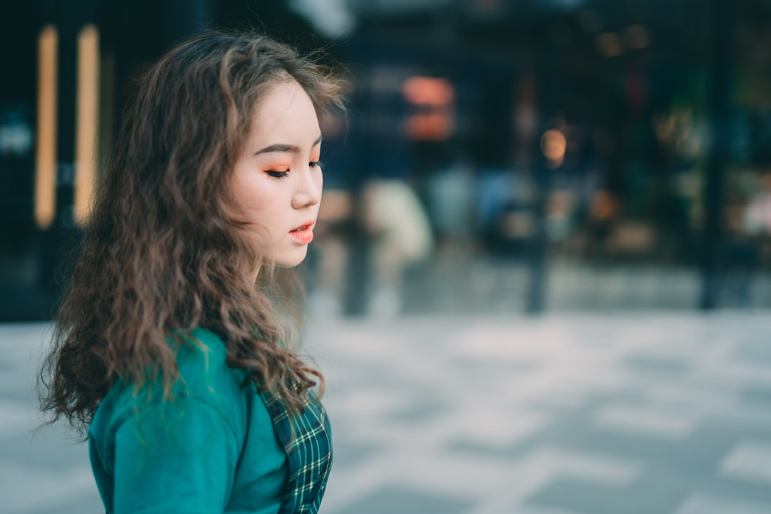 woman in green long-sleeved shirt