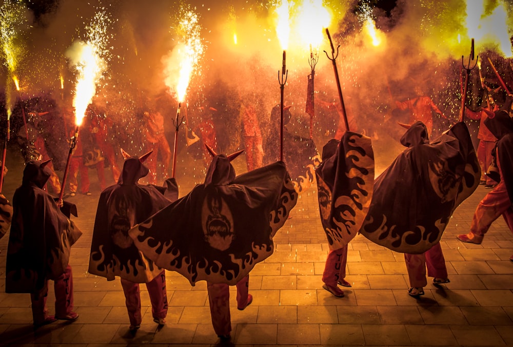 people holding fire crackers