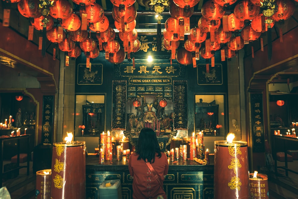 woman wearing red dress on altar