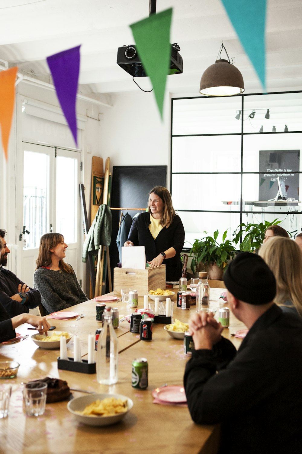 people in sitting in front of rectangular wooden table