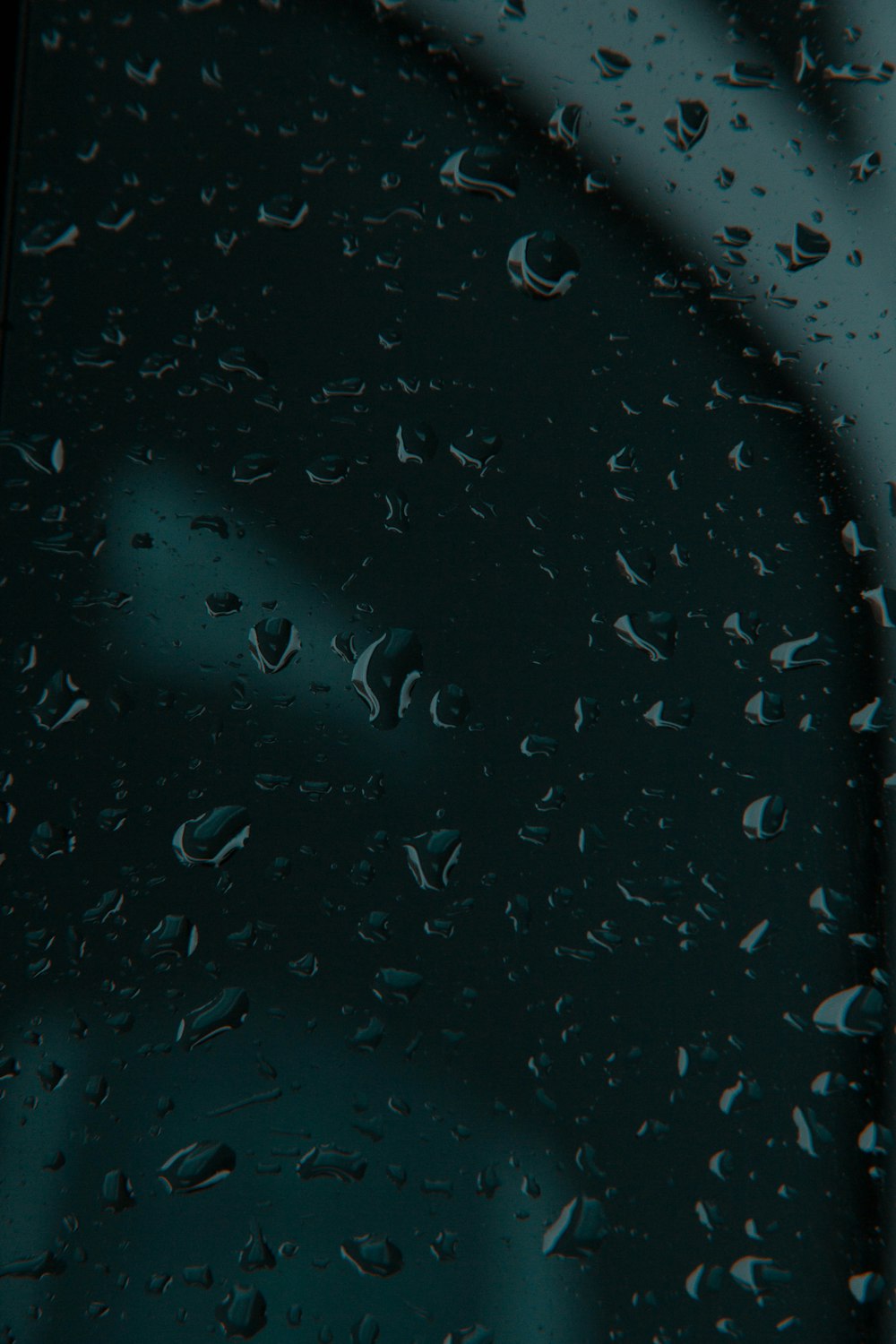 a close up of rain drops on a window