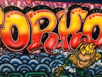 A vibrant graffiti artwork featuring the word 'PORKO' in large, bold, and colorful letters with a gradient of red, orange, and yellow hues. The background includes stylized purple and pink designs at the top and blue waves at the bottom. There is a depiction of a character with blonde hair wearing a green and yellow costume emerging from the waves, holding a trident.