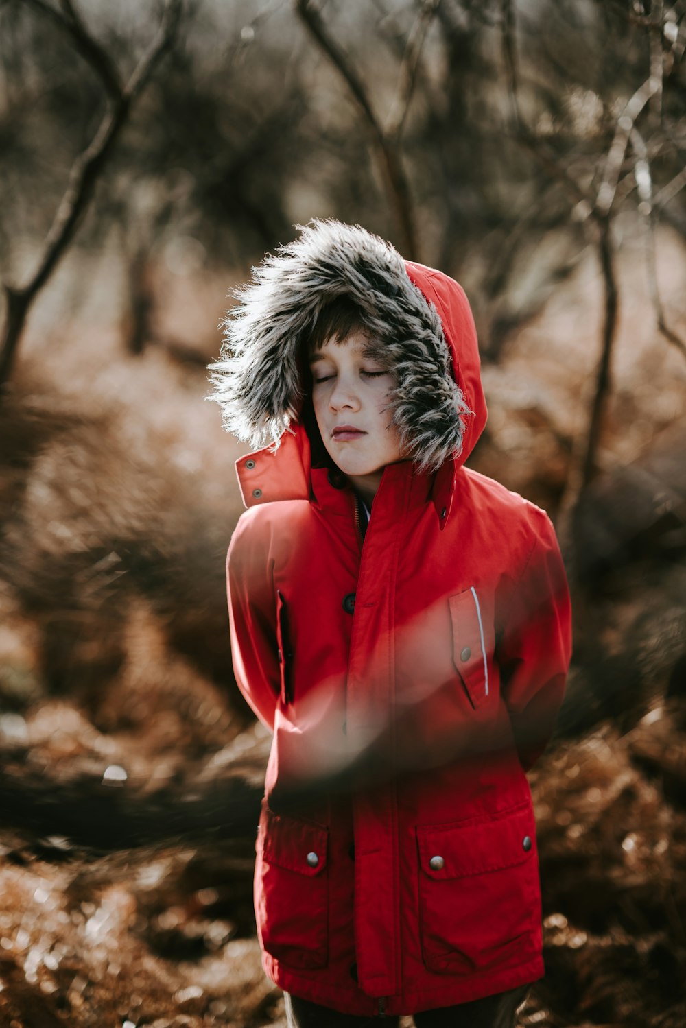 man wearing red coat