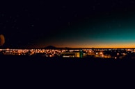 A nighttime cityscape with subtle space-inspired gradients, symbolizing the future of learning and digital empowerment.