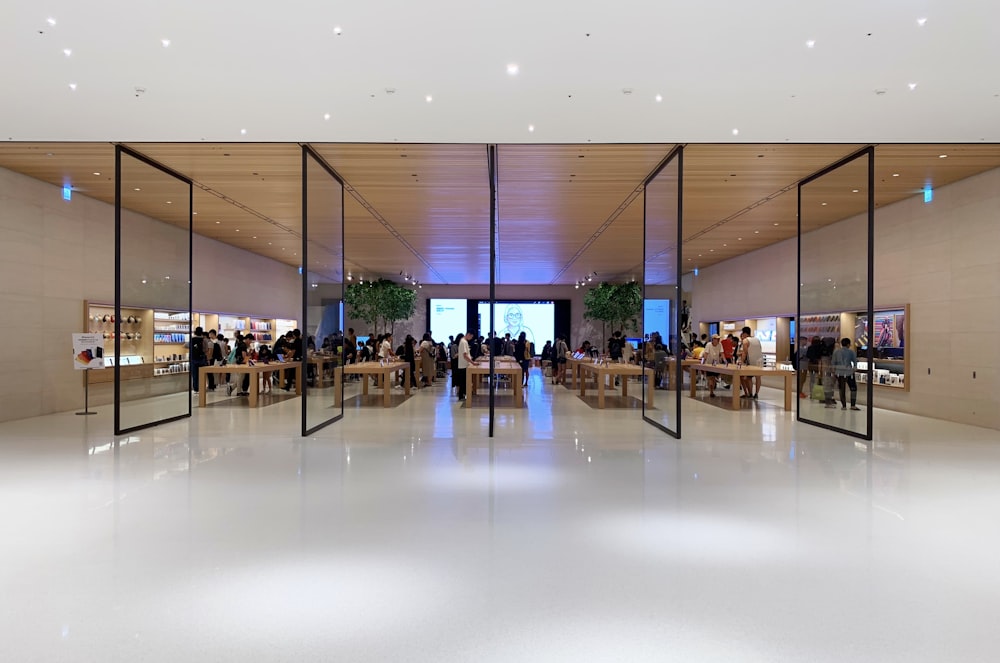 people standing near brown wooden tables