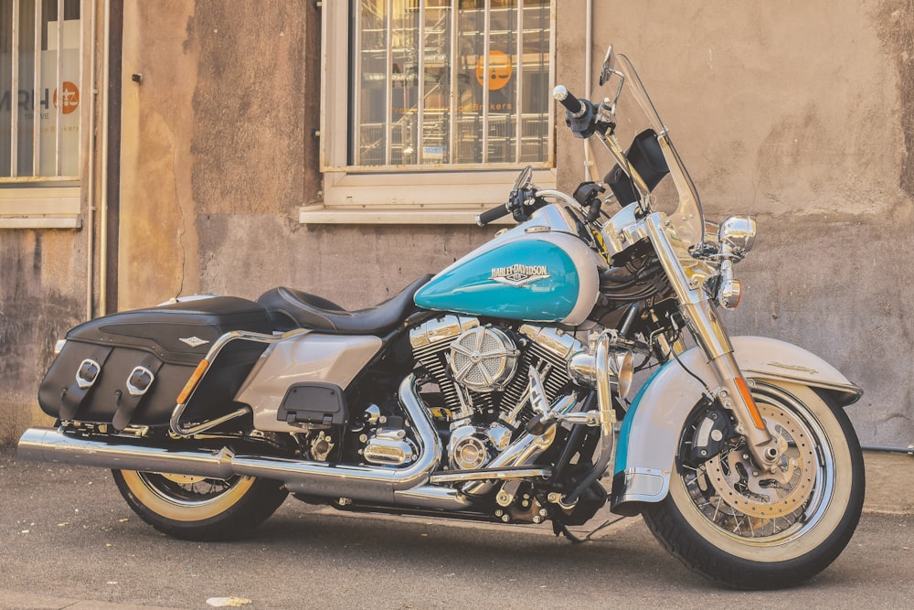 teal and white touring motorcycle