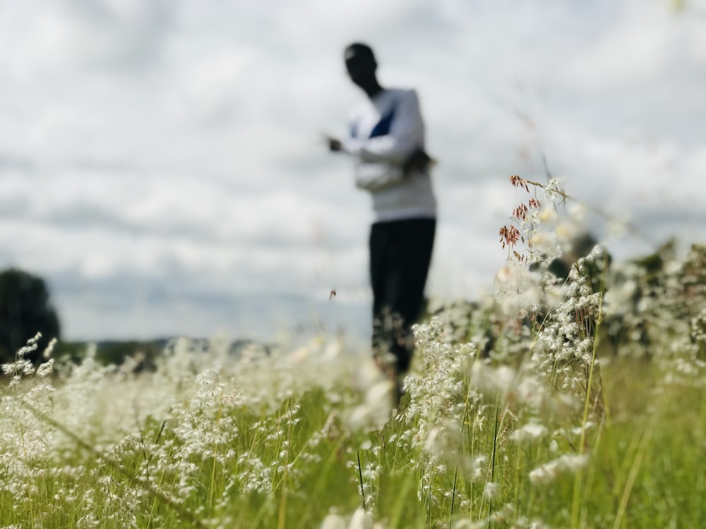 man standing near plants