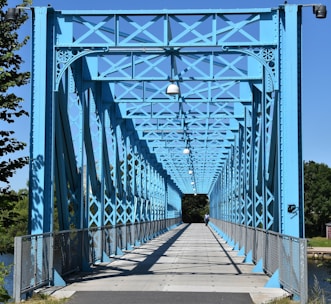 grey and blue metal bridge during daytime