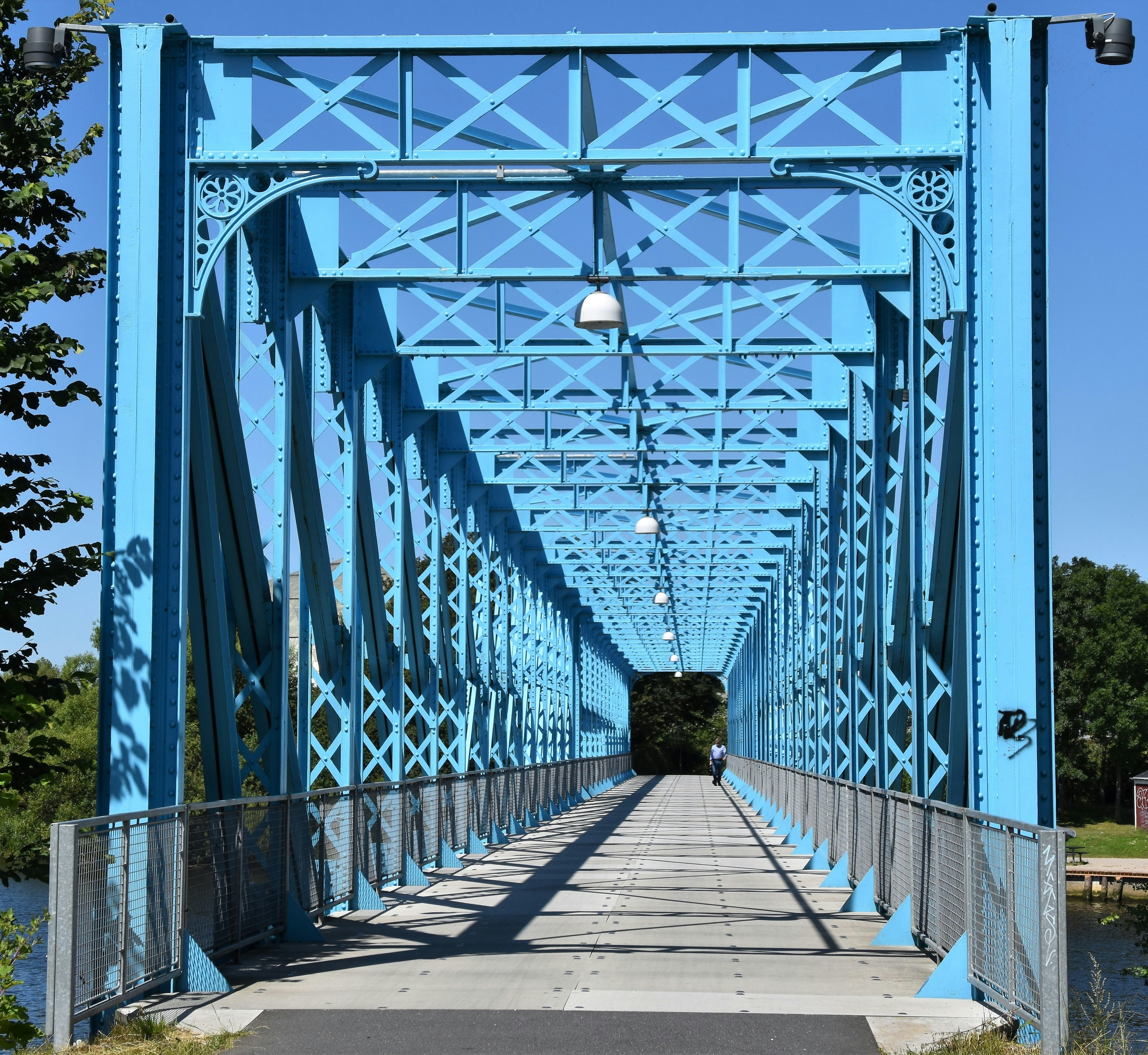 grey and blue metal bridge during daytime