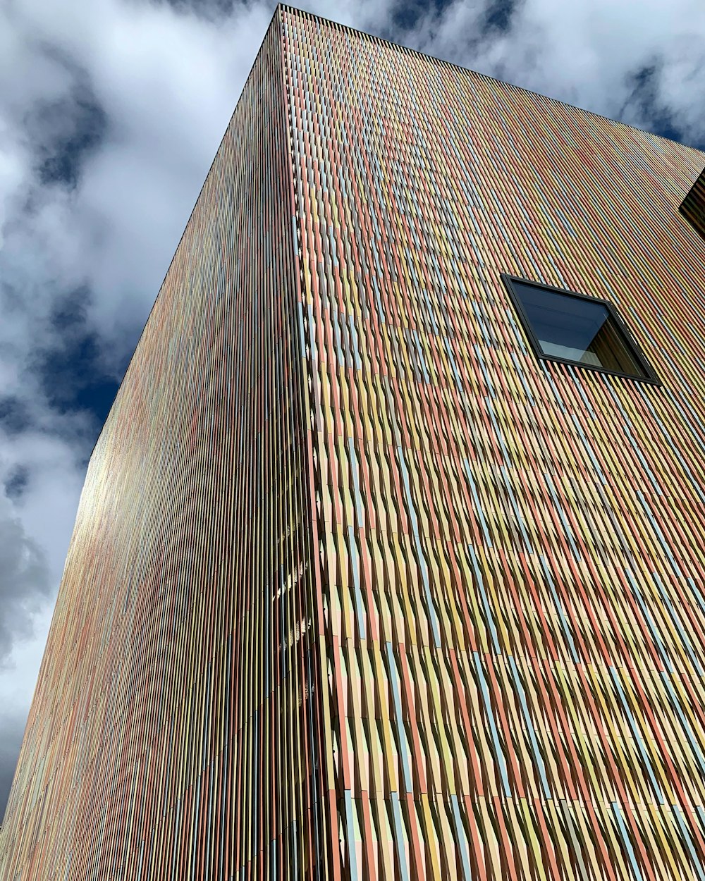 a very tall building with a sky background