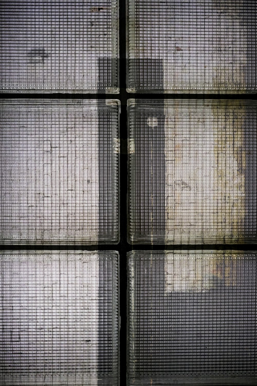a close up of a wall with metal bars