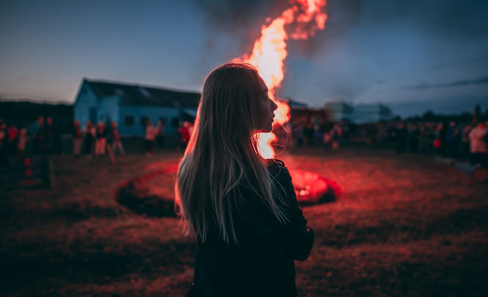 woman standing near fire