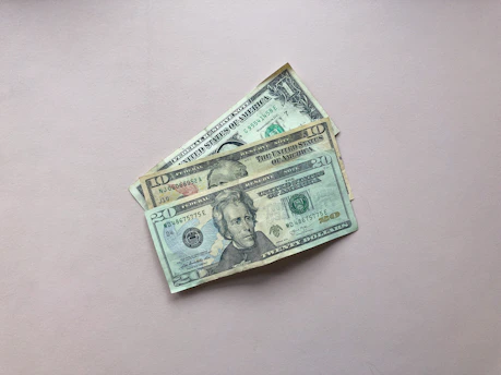 three assorted-denomination U.S. dollar banknotes