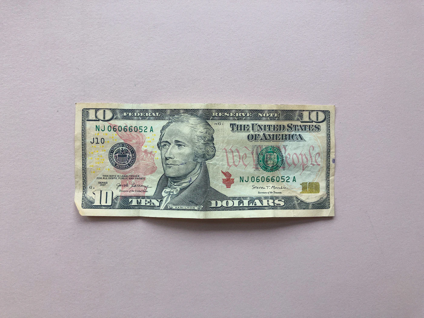 Close-up of a U.S. $10 banknote showing Alexander Hamilton's portrait