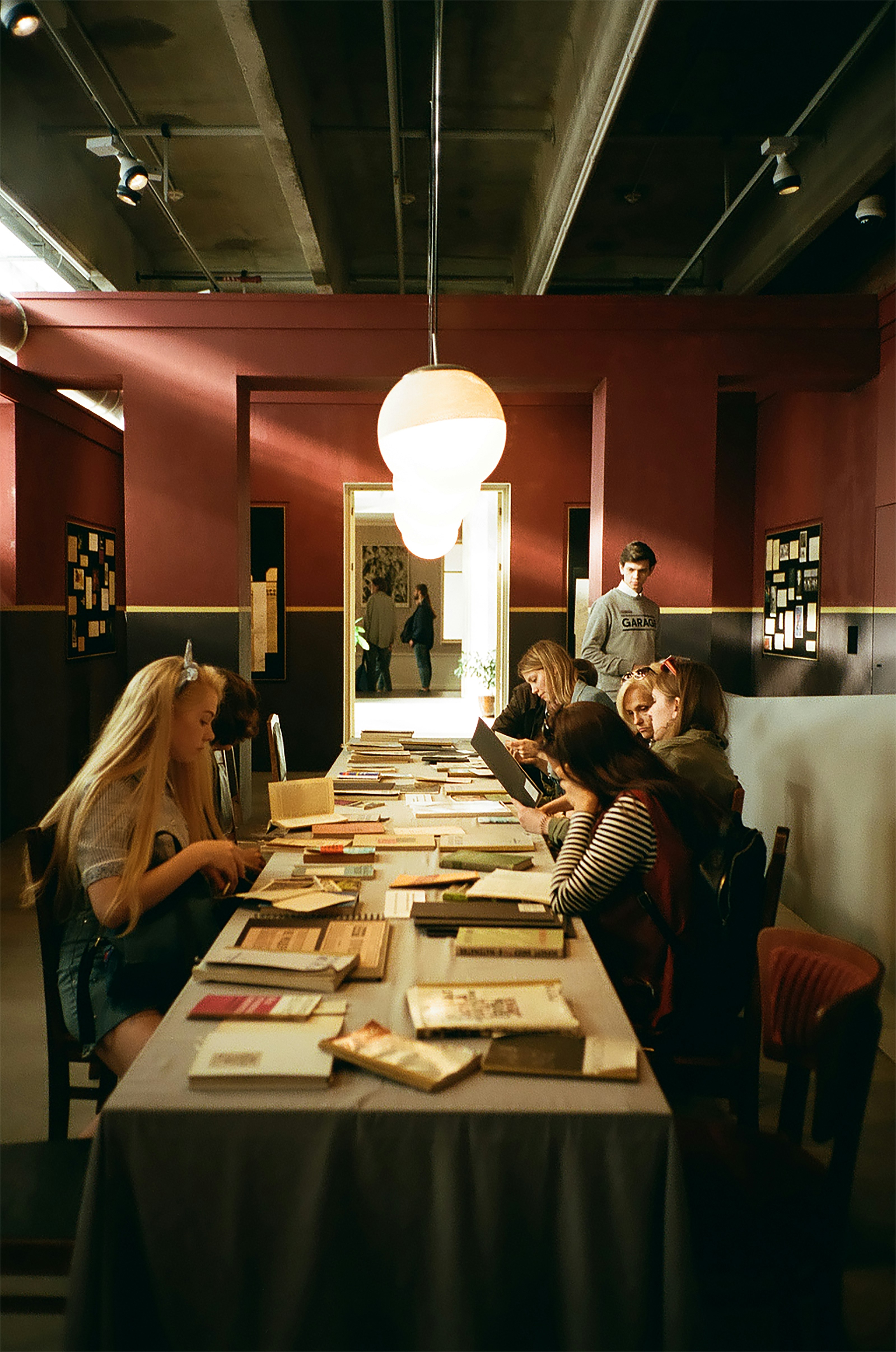 Women sitting at table reading books photo – Free Food Image on Unsplash