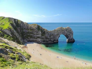 rocky mountain on body of water