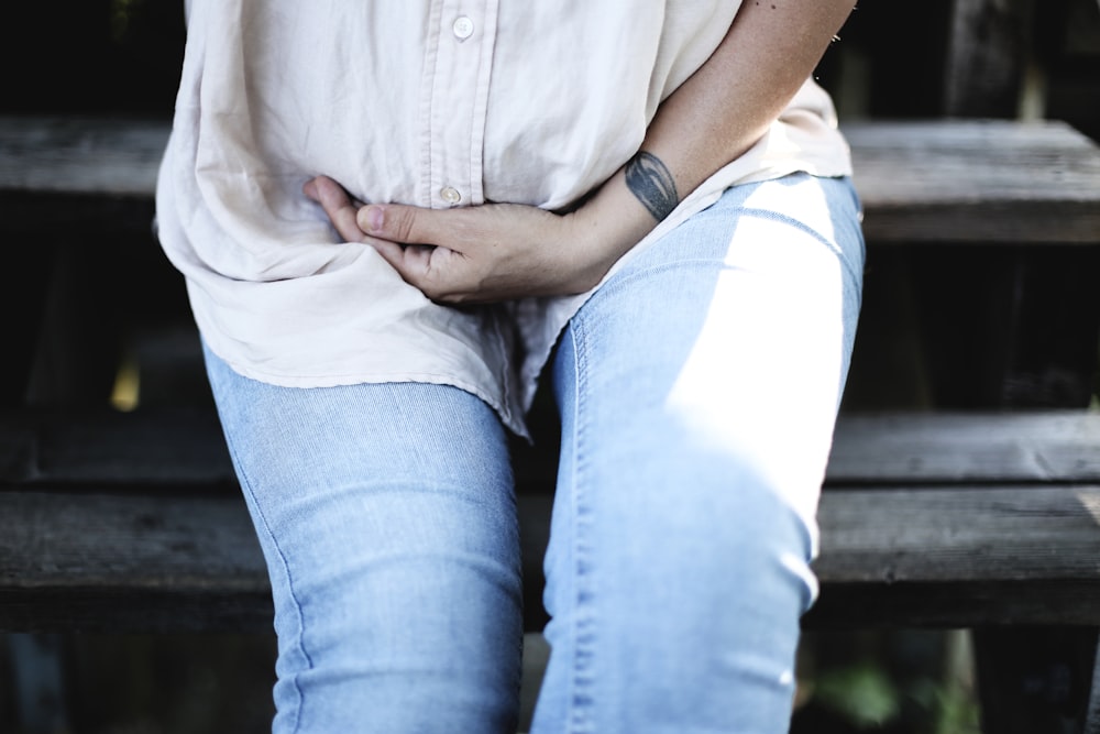 person sitting on wooden stairs