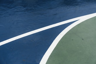 A detailed view of a freshly constructed sports court with precise markings and smooth surface.