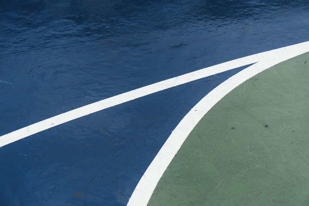 blue, green, and white basketball court