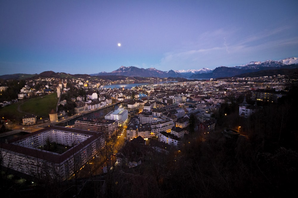 a view of a city with mountains in the background