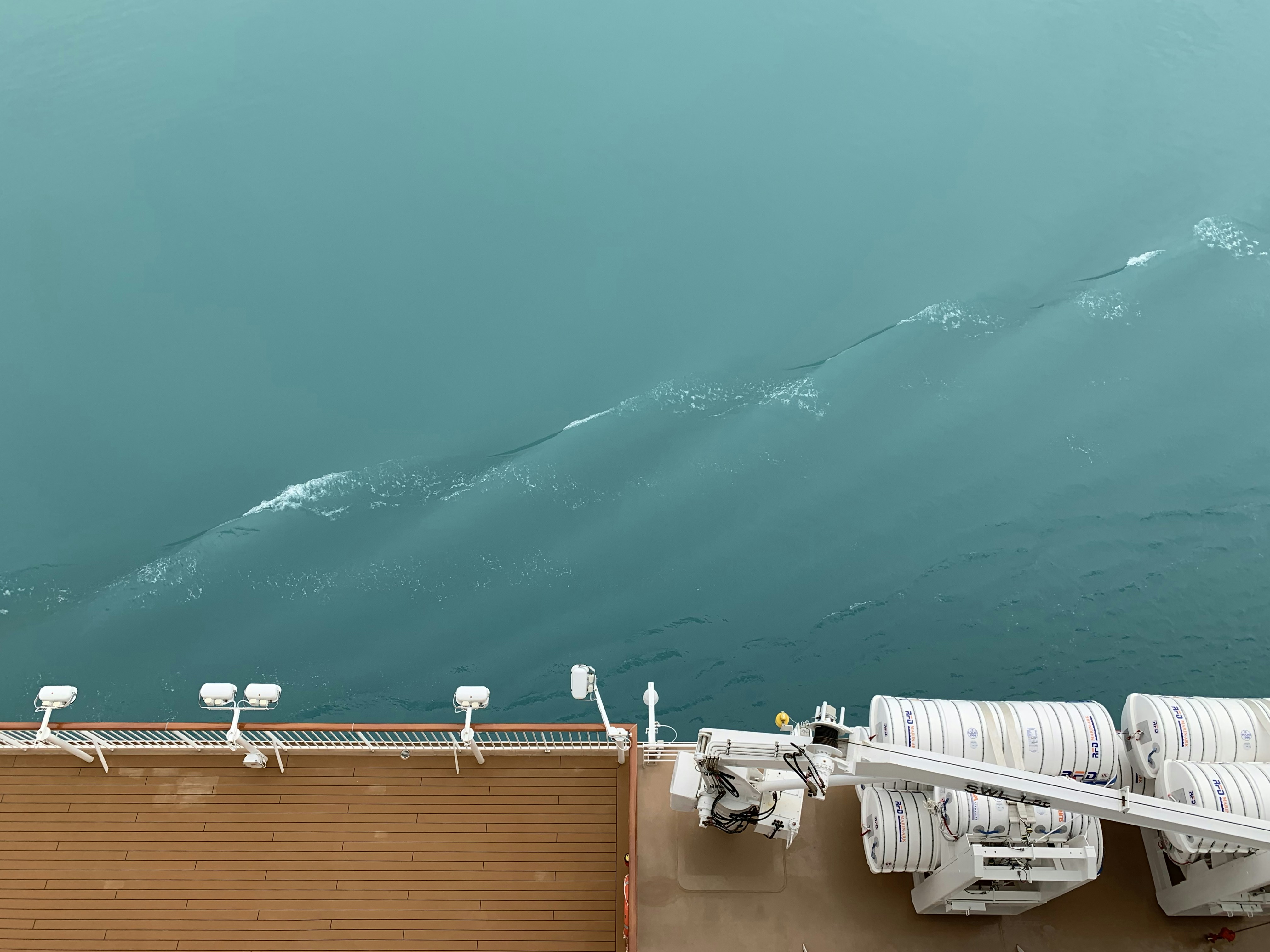 brown ship sailing on calm sea