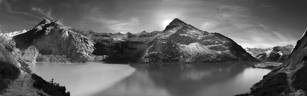 calm water beside mountain