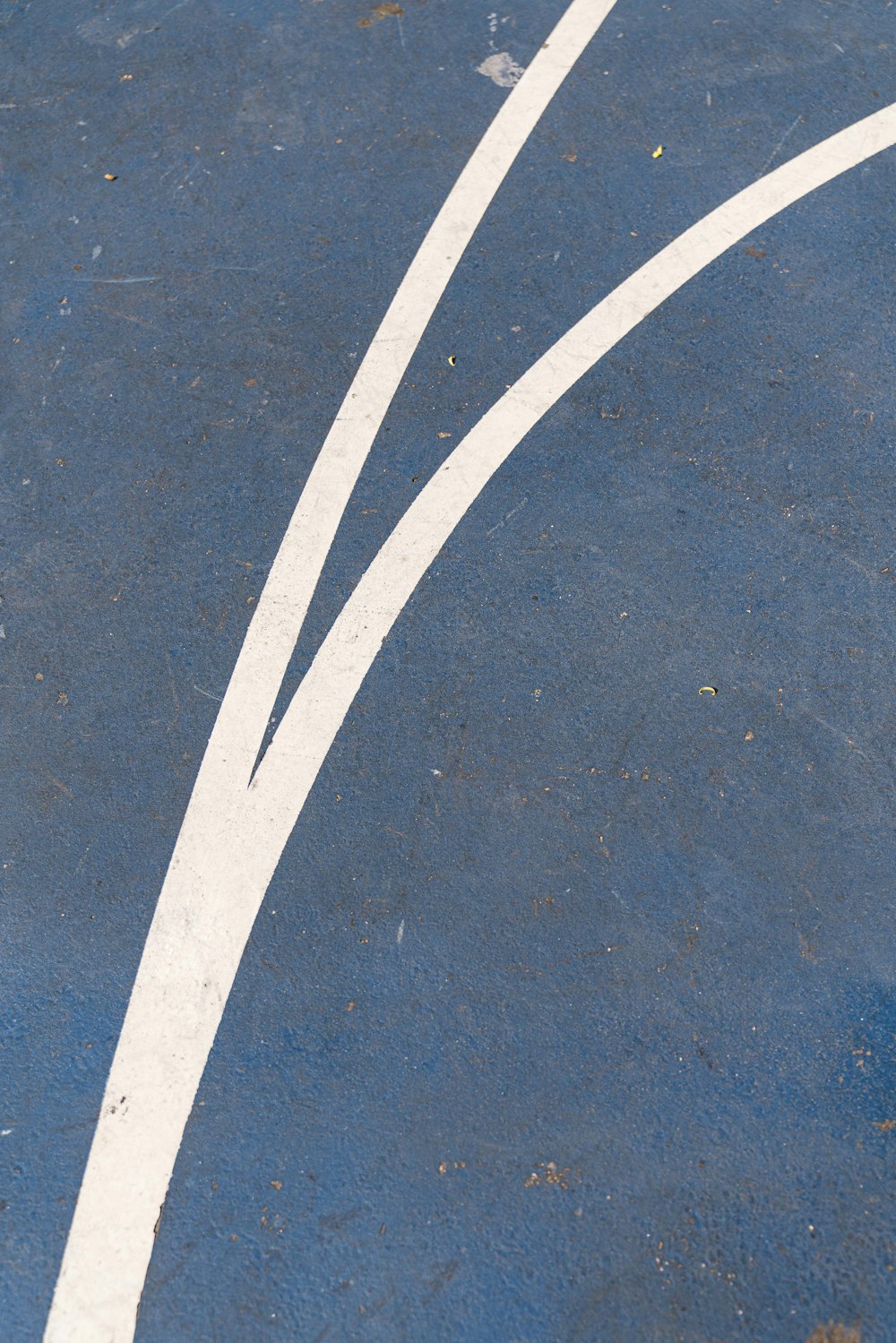 a tennis court with a white line painted on it