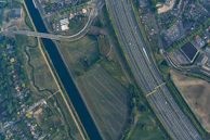 Aerial shot of a sprawling infrastructure project with roads and water channels.